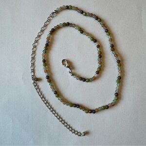 11 inch delicate beaded necklace. Adjustable length. Earth tones.